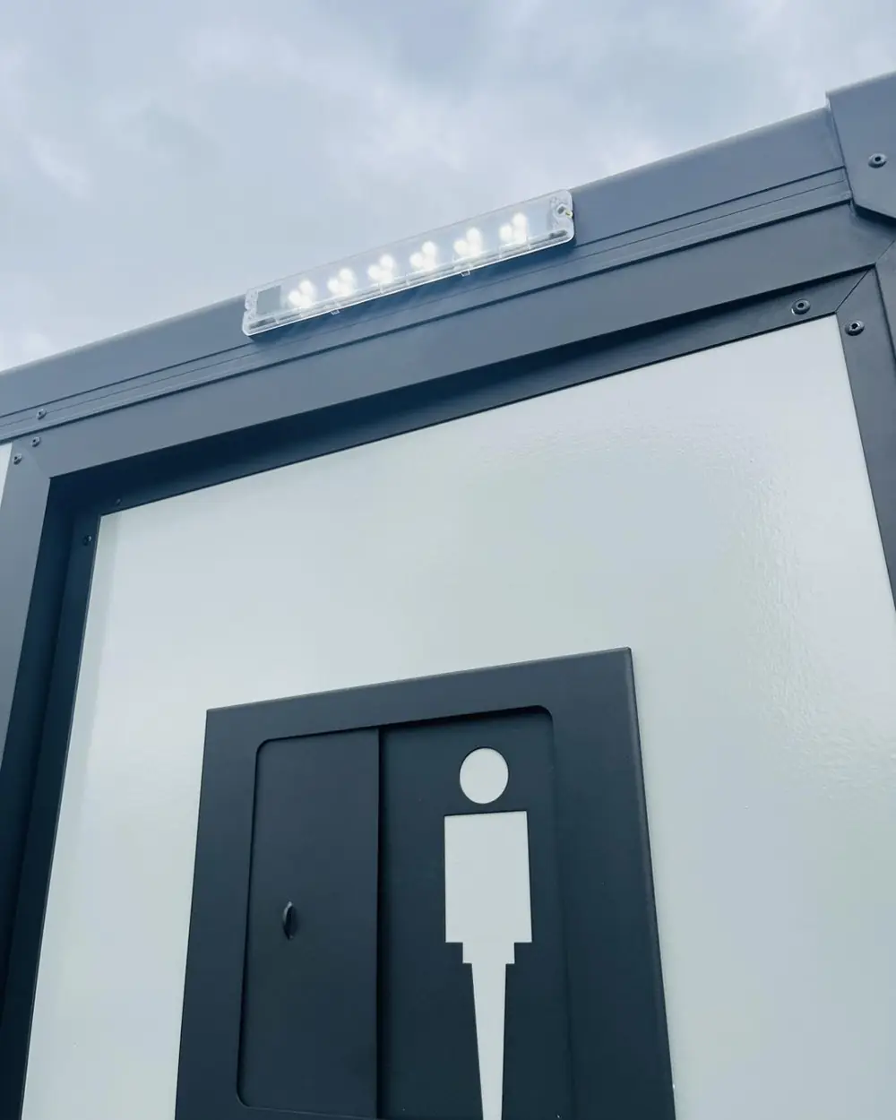 Men's door sign on a restroom trailer